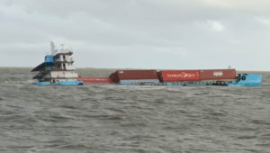 Crew rescued as container ship capsized